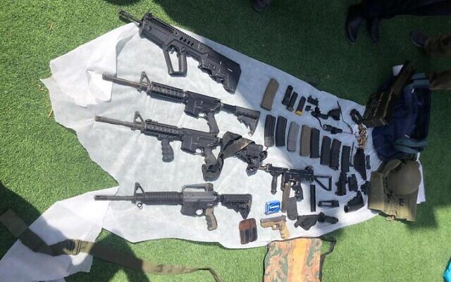 Weapons seized after a police raid in the West Bank city of Hebron, August 18, 2022. (Israel Police)