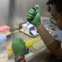 A research assistant prepares a PCR reaction for polio at a lab at Queens College on August 25, 2022, in New York City. (Angela Weiss/AFP)