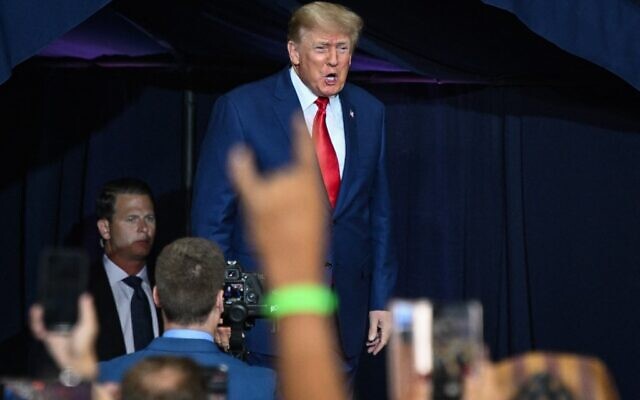 Former US President Donald Trump arrives for a campaign rally in support of Doug Mastriano for Governor of Pennsylvania and Mehmet Oz for US Senate at Mohegan Sun Arena in Wilkes-Barre, Pennsylvania on September 3, 2022. (Photo by Ed JONES / AFP)