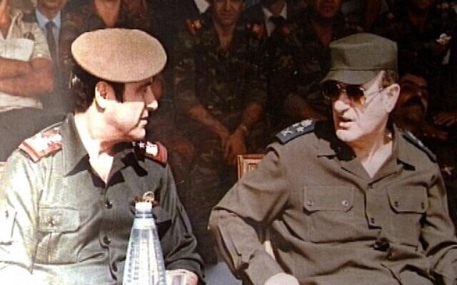 Late Syrian President Hafez Assad (R) with his youngest brother Rifaat (L) at a military ceremony in Damascus, January 1, 1984. (Handout/AFP)