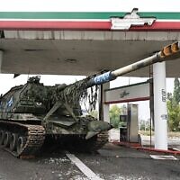 This photograph taken on September 16, 2022, shows an abandoned Russian tank at a gas station on the outskirts of Izyum, in the Kharkiv region, eastern Ukraine on September 16, 2022, after Ukrainian forces recaptured the eastern city from the Russians. (Juan Barreto/AFP)