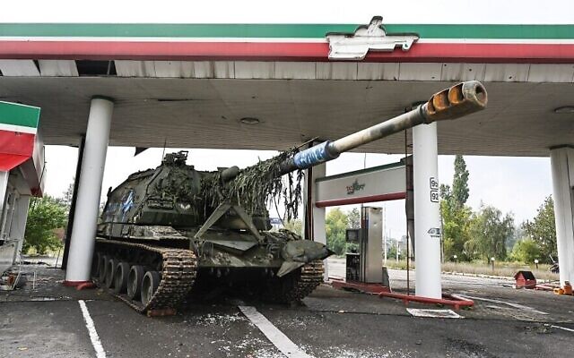 An abandoned Russian tank at a gas station on the outskirts of Izyum, in the Kharkiv region, eastern Ukraine on September 16, 2022, after Ukrainian forces recaptured the eastern city from the Russians. (Juan Barreto/AFP)