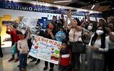 Relatives cheer upon the arrival of crew members of the Venezuelan Boeing 747-300 from Emtrasur Cargo airline at Simon Bolivar International Airport in Maiquetia, La Guaira State, Venezuela, on September 16, 2022. (Federico PARRA / AFP)