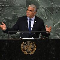 Prime Minister Yair Lapid addresses the 77th session of the United Nations General Assembly at the UN headquarters in New York City on September 22, 2022. (Timothy A. Clary/AFP)