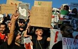 Iranians living in Greece chant slogans and hold placards during a demonstration in central Athens  on September 24, 2022, following the death of an Iranian woman after her arrest by the country's morality police in Tehran. (Louisa Gouliamaki/AFP)
