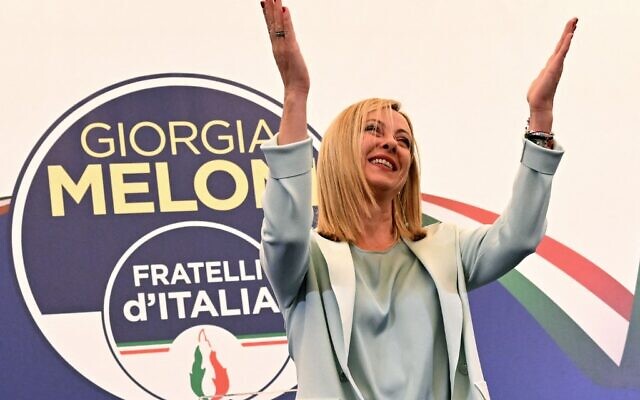 Leader of Italian far-right party Brothers of Italy Giorgia Meloni acknowledges the audience after she delivered an address at her party's campaign headquarters overnight on September 26, 2022 in Rome. (Andreas Solaro/AFP)