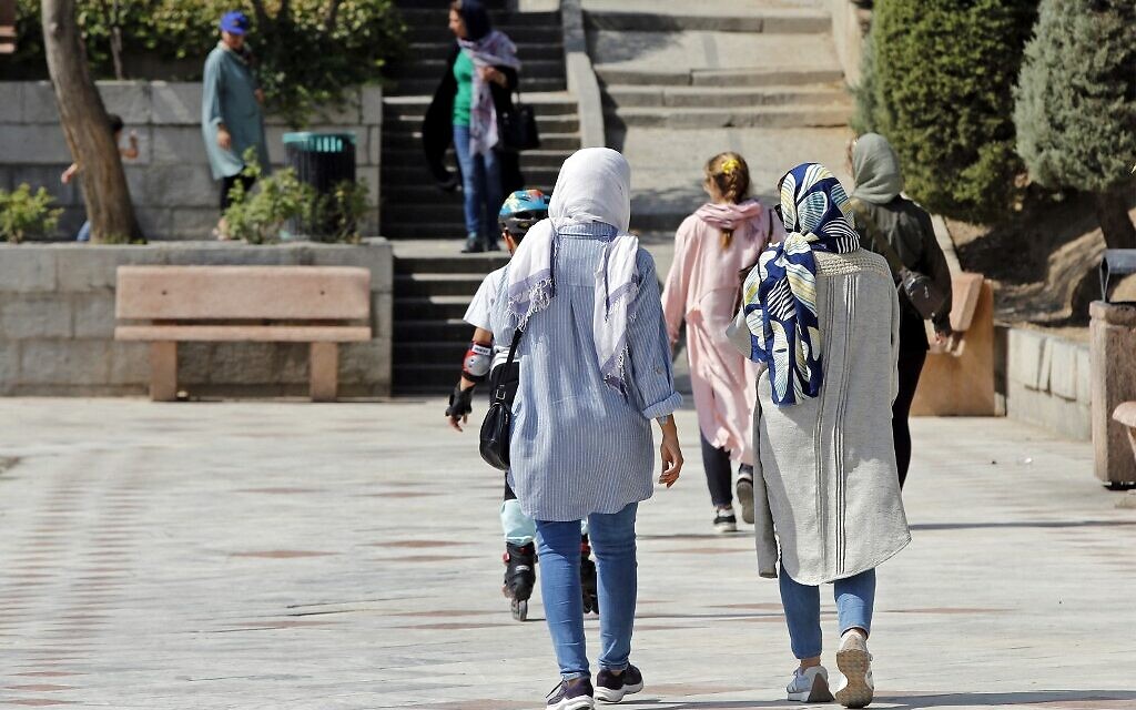 Women walk in a park in Iran's capital Tehran, September 27, 2022. (Photo by AFP)