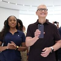 Apple CEO Tim Cook holds a new iPhone 14 Pro during an Apple special event on September 07, 2022 in Cupertino, California. (Justin Sullivan/Getty Images/AFP)