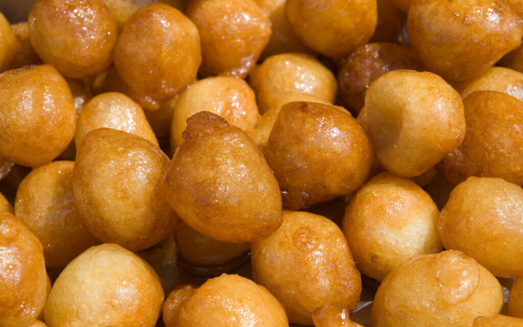 Taygalach, crunchy dough balls boiled in honeyed syrup until soaked through and sticky. (The Nosher/ JTA)