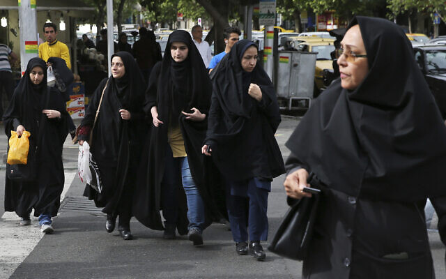 Illustrative: In this Sunday, April 22, 2018, photo, head-to-toe veiled Iranian women cross a street in Tehran, Iran.  (AP Photo/Vahid Salemi)