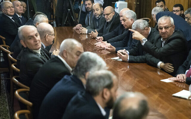 Fatah and Hamas officials wait for a meeting with Russian Foreign Minister Sergei Lavrov in Moscow, Russia, Tuesday, February 12, 2019. (AP/Pavel Golovkin)