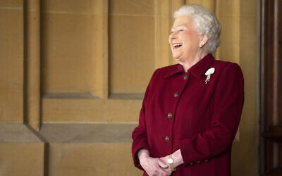 Britain's Queen Elizabeth II laughs at Windsor Castle in Windsor, southern England on April 11, 2014 (Leon Neal, Pool Photo via AP, File)