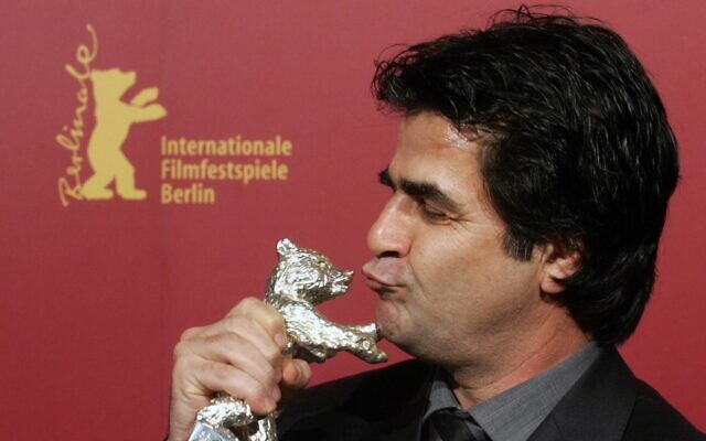 Iranian director Jafar Panahi poses with his Silver Berlin Bear award at the 56th Berlinale International Film Festival in Berlin, February 18, 2006. (AP Photo/ Arnd Wiegmann, Pool, File)