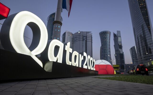 Branding is displayed near the Doha Exhibition and Convention Center, in Doha, Qatar, March 31, 2022. (AP Photo/Darko Bandic, File)