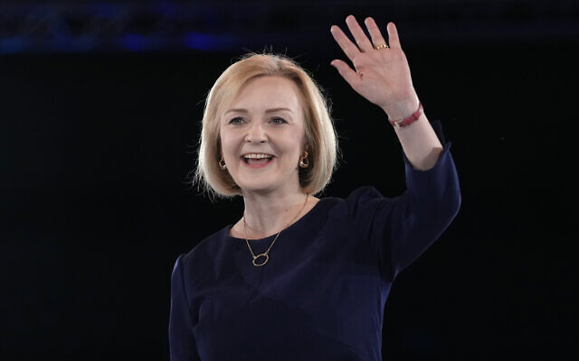 Liz Truss waves on stage after a Conservative leadership election hustings at Wembley Arena in London, August 31, 2022. (AP Photo/Kirsty Wigglesworth)