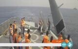 In this frame grab from Iranian state television, Iranian navy sailors throw an American sea drone overboard in the Red Sea on September 1, 2022. (Iranian state television via AP)