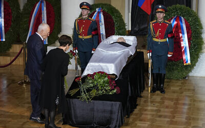 People stand by the coffin of former Soviet President Mikhail Gorbachev inside the Pillar Hall of the House of the Unions during a farewell ceremony in Moscow, Russia, September 3, 2022. (AP Photo/Alexander Zemlianichenko)