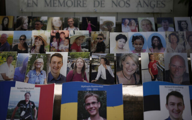 "In Memory of our Angels" is engraved on the on the memorial of the victims of the attack of July 14, 2016 with pictures of the victims along Nice's Promenade des Anglais, to commemorate the 2016 terror attack, in Nice, South of France, Sunday, Sept. 4, 2022. Eight suspects will face trial in a Paris Court on Monday, in connection with the 2016 Bastille Day truck attack in Nice that left 86 people dead. (AP Photo/Daniel Cole)
