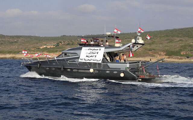 FILE: Lebanese protesters ride in a yacht with an Arabic banner that reads 'No compromises No waivers, No negligence, Our maritime resources belong to us,' during a demonstration demanding Lebanon's right to disputed maritime oil and gas fields, in the southern marine border town of Naqoura, Lebanon, September 4, 2022. (AP Photo/ Mohammed Zaatari)
