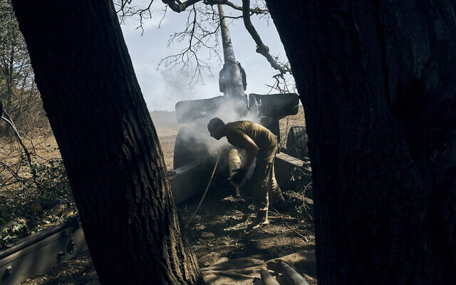A Ukrainian soldier fires on the front line in the Donetsk region, eastern Ukraine, September 3, 2022. (Kostiantyn Liberov/AP)