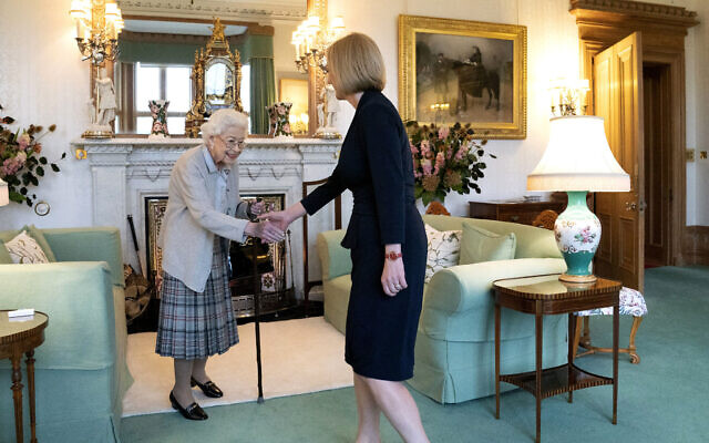 Britain's Queen Elizabeth II, left, welcomes Liz Truss during an audience at Balmoral, Scotland, where she invited the newly elected leader of the Conservative party to become Prime Minister and form a new government, September 6, 2022. (Jane Barlow/Pool Photo via AP)