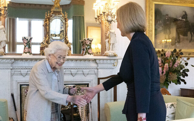Britain’s Queen Elizabeth II, left, welcomes Liz Truss during an audience at Balmoral, Scotland, where she invited the newly elected leader of the Conservative party to become Prime Minister and form a new government, Sept. 6, 2022. (Jane Barlow/Pool Photo via AP)