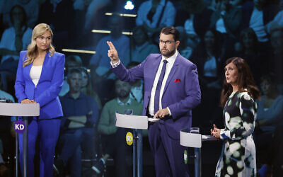 Ebba Busch, leader of the Christian Democrats, left, Jimmie Akesson, leader of the Sweden Democrats and Marta Stenevi, spokesperson for the Green Party, right, take part in a political debate broadcasted on TV4 from Eskilstuna, Sweden, Thursday September 8, 2022. General elections will be held in Sweden on September 11. (Christine Olsson/TT via AP)