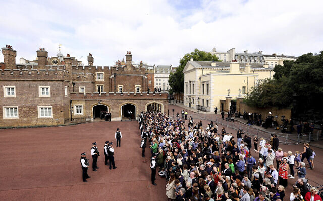 Crowds gather outside St James's Palace in London, Sept. 10, 2022, during the Accession Council ceremony at St James's Palace, London, where King Charles III is formally proclaimed monarch (Richard Heathcote/pool via AP)