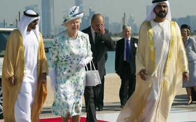 Britain's Queen Elizabeth II and Prince Philip, accompanied by the Prime Minister of the UAE, Sheikh Mohammed Bin Rashid Al Maktoum, right, arrive to visit the Zayed National Museum in Abu Dhabi, as part of their visit to the Gulf, Nov. 25, 2010. (Arthur Edwards/AP)