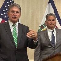 US Sen. Joe Manchin, a West Virginia Democrat, and Competitive Power Ventures CEO Gary Lambert, right, speak at a news conference Friday, September 16, 2022, in Charleston, West Virginia. CPV plans to build a natural gas power plant designed to capture climate-changing carbon in West Virginia. (AP Photo/John Raby)