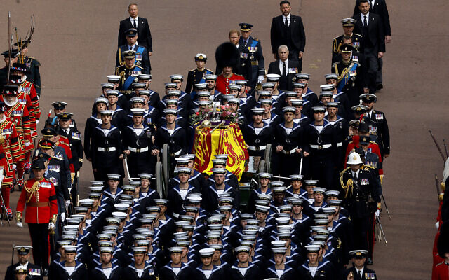 Queen Elizabeth II's funeral cortege borne on the State Gun Carriage of the Royal Navy travels along The Mall  in London, Sept. 19, 2022. (Chip Somodevilla/Pool Photo via AP)