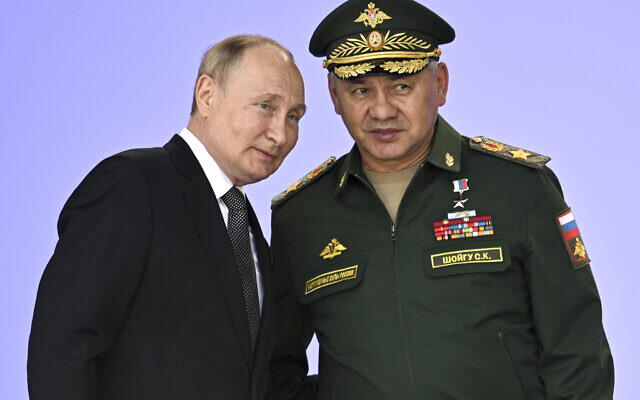 Russia's President Vladimir Putin, left, and Russian Defense Minister Sergei Shoigu attend the opening of the Army 2022 International Military and Technical Forum outside Moscow, Russia, August 15, 2022. (Sputnik, Kremlin Pool Photo via AP, File)