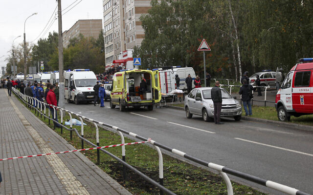 Police and paramedics work at the scene of a shooting at school No. 88 in Izhevsk, Russia, September 26, 2022. (AP Photo)