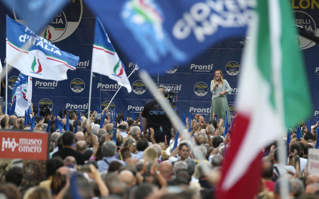 Right-wing party Brothers of Italy's leader Giorgia Meloni, center-right on stage, addresses a rally as she starts her political campaign ahead of September 25 general elections, in Ancona, Italy, August 23, 2022. (AP Photo/Domenico Stinellis, File)