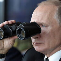 Russian President Vladimir Putin holds binoculars while watching the military exercises Center-2019 at Donguz shooting range near Orenburg, Russia, in Sept. 20, 2019. (Alexei Nikolsky, Sputnik, Kremlin Pool Photo via AP)