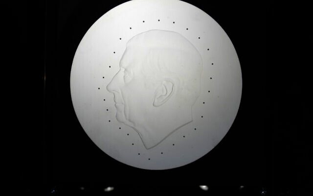 The template created by British sculptor Martin Jennings for the official portrait of King Charles III for use on coins on display during a press preview in London, September 29, 2022. (AP Photo/Alastair Grant)