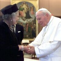 In this is Tuesday, Oct. 17, 2000 file photo, Britain's Queen Elizabeth II and Pope John Paul II meet at the Vatican (AP Photo/Alessandro Bianchi, Pool, File)