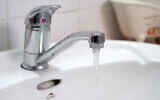 An illustrative photo of tap water running from a sink.(Chen Leopold/Flash90)