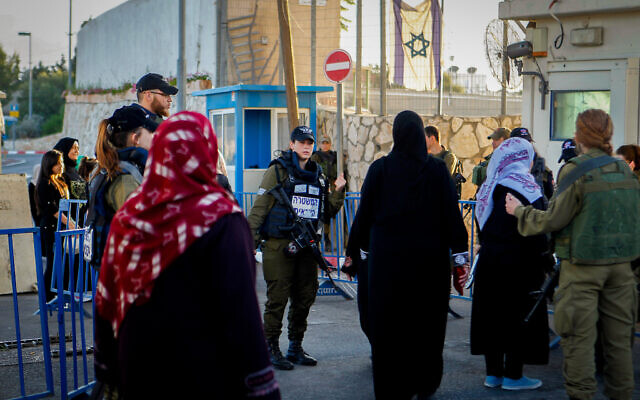 Illustrative: Palestinian women at a checkpoint in the West Bank city of Bethlehem June 10, 2016. (Wisam hashlamoun/FLASH90/File)