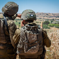 File: Israeli soldiers are seen in Metula, on the border between Israel and Lebanon, northern Israel, on May 15, 2021. (Basel Awidat/Flash90)