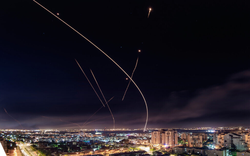 The Iron Dome anti-missile system fires interceptor missile towards rockets launched by terror groups from the Gaza Strip into Israel, over the southern Israeli city of Ashkelon, during Operation Guardian of the Walls, May 16, 2021. (Avi Roccah/Flash90)