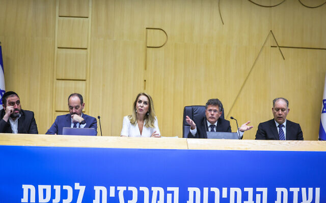 Director of the Elections Committee of the Knesset, Orly Adas, Yitzhak Amit, Chairman of the Election Committee and Attorney Ilan Bombach, Vice Chairman of the Election Committee at the Election Committee where political parties running for a spot in the upcoming Israeli elections arrive to present their party list, at the Knesset, the Israeli parliament, in Jerusalem, on September 29, 2022. (Yonatan Sindel/Flash90)