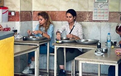 Donya Rad (R) was arrested after posting this picture of her eating breakfast in Iran without an hijab, her family said on September 30 2022 (Twitter)