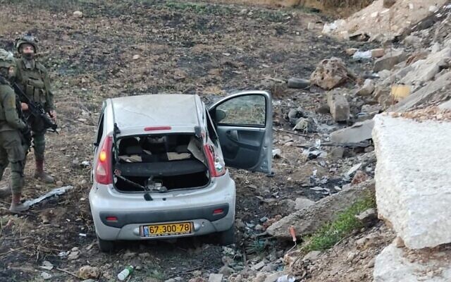 Israeli troops are seen at the scene of a suspected car-ramming attack in Huwara, in the northern West Bank, September 22, 2022. (Social media)