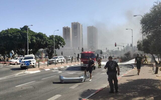 Police and Fire and Rescue services on the scene of a car explosion in the northern city of Acre, September 24, 2022. (Israel Police)