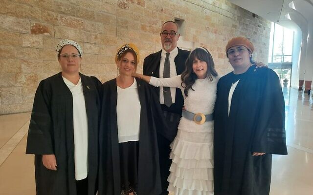 Lonna Ralbag, in white, with her attorneys at Israel's Supreme Court for her hearing against her recalcitrant husband in July 2022. (Yad La'Isha)