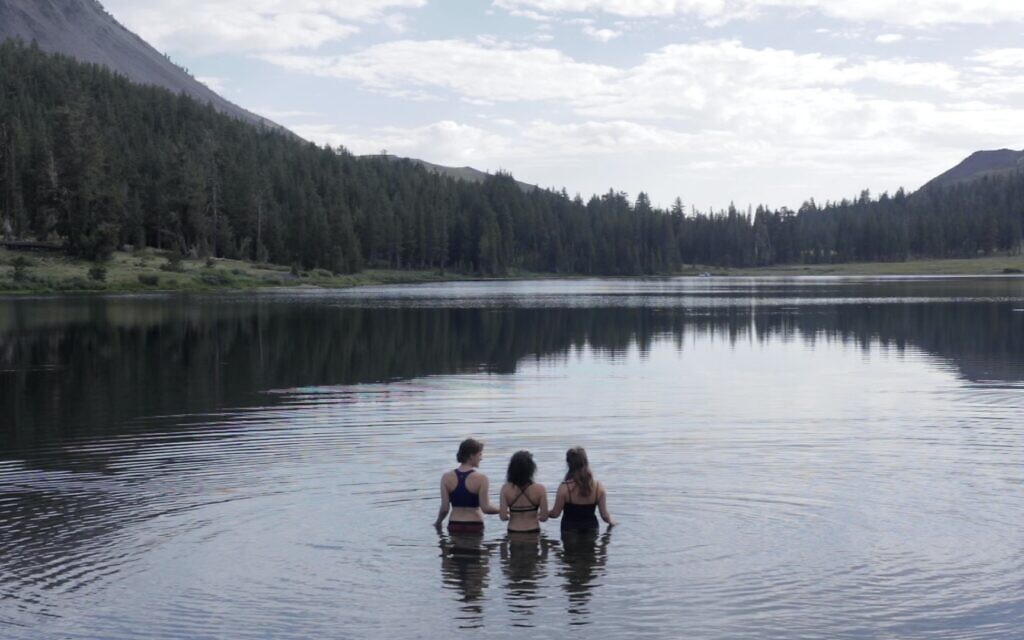 Nina Gordon-Kirsch and two others using the natural waters of Highland Lakes as a mikveh, or ritual bath, at the end of her journey on July 29, 2022. (Courtesy/ Sky Richards)