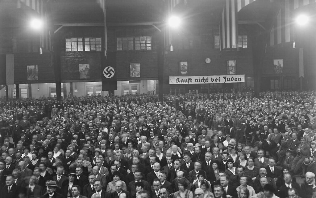 A Nazi rally. The sign in the background says 'Kauft nicht bei Juden,' or Don't buy from Jews. (National Archives and Record Administration)