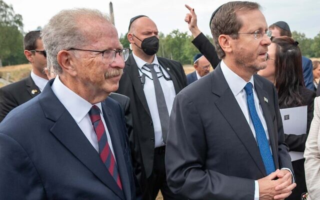 Menachem Rosensaft, left, accompanies Israeli President Isaac Herzog, right, on a visit to the Bergen Belsen concentration camp, September 6, 2022. (Shahar Azran/WJC via JTA)