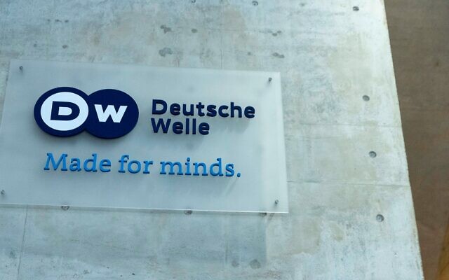 The Deutsche Welle logo is seen on the foyer of the German broadcaster's Berlin location, March 2, 2022. (Carsten Koall/picture alliance via Getty Images via JTA)
